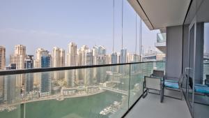 a balcony with a view of a city at Luxury StayCation - Tranquil Waters: 2BR Luxury Apart in Dubai Marina in Dubai