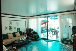 a living room with a couch and a table at Sky Hotel Bắc Giang in Bắc Giang