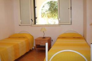 Ένα ή περισσότερα κρεβάτια σε δωμάτιο στο Delta Club Residence