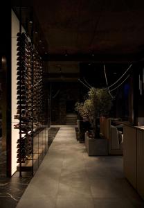 a room with a large wall of wine bottles at Diamond Resort White in Bukovel