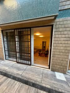 a sliding glass door of a building with a patio at Presty Apartments in Milan