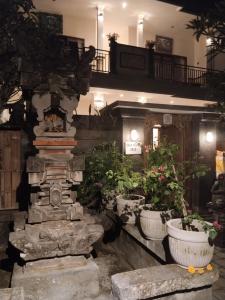 a group of potted plants in a building at DANU HOUSE UBUD in Ubud