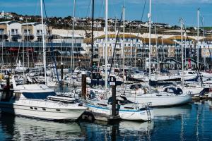 a group of boats docked in a harbor at Marina with a view / 2 bd flat in Brighton & Hove