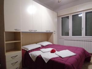 Posteľ alebo postele v izbe v ubytovaní Villa Glori affitto camere monolocali