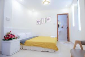 Postel nebo postele na pokoji v ubytování Vietnam Hotel Dalat