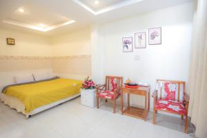 Postel nebo postele na pokoji v ubytování Vietnam Hotel Dalat