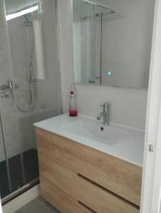 a bathroom with a sink and a shower with a mirror at Villa Franz House Casa de Invitados in Canyelles +18 photos