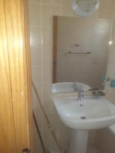 a bathroom with a sink and a mirror at Sheraton ap . in Hurghada