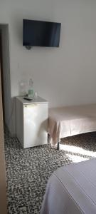 A television and/or entertainment centre at Hotel Conca d'Oro
