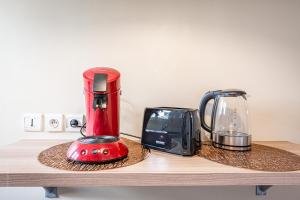 a red blender and a toaster on a counter at Luxe Flat for 7 - Fairytale Factory in Bussy-Saint-Georges