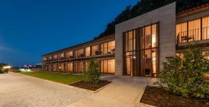 an exterior view of a building at night at Solar de Vila Meã in Barcelos