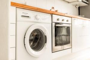 a white washer and dryer in a kitchen at Downtown Light-Filled Retreat in Helsinki