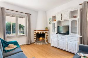 TV a/nebo společenská místnost v ubytování Villa Enzo - PlusHolidays