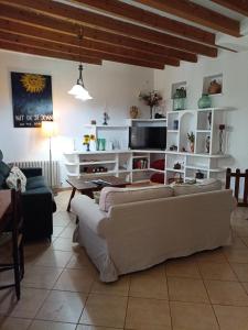 a living room with a couch and a table at Casa Es Mercat in Sóller