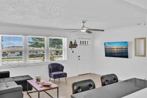 a living room with a couch and a table and chairs at 3 Bedroom Villa In F Lauderdale Casino & Beach in Fort Lauderdale