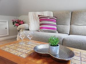 a living room with a couch and a coffee table at Valley House in Exeter