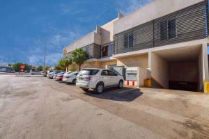 a car parked in a parking lot next to a building at شقق المبات للشقق المخدومة in Riyadh