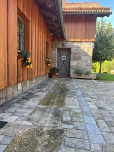 a building with a door and a stone walkway at Apartmán Kamenný Dům in Jilemnice