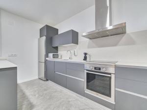 Η κουζίνα ή μικρή κουζίνα στο Apartment Sua Loft by Clabao