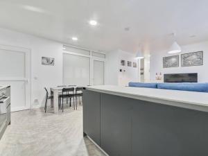 a kitchen and dining room with a table and chairs at Apartment Sua Loft by Clabao in Pamplona +38 photos