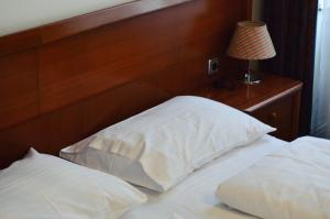 Postel nebo postele na pokoji v ubytování Hotel Pension Lumes - Self Check In