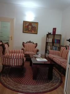 a living room with two couches and a coffee table at Car Konaci in Smederevo