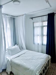 Postel nebo postele na pokoji v ubytování MELVIC INN