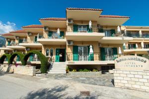 a large building with a sign in front of it at Konstantinos Hotel & Apartments 2 in Nydri