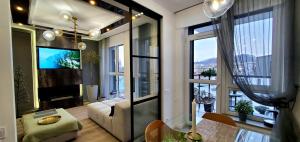 a living room with a view of a city at Apart-terrace on Baker Street in Lviv