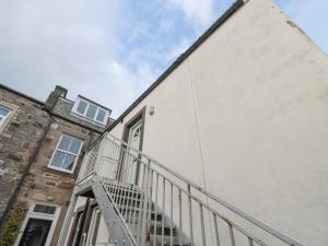 a building with a staircase next to a building at 60B Castlegate in Berwick-Upon-Tweed