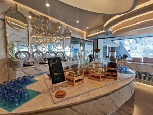 a counter with a bunch of glass vases on it at Water park Rawai Beach 200m Nai Han king bedroom in Rawai Beach