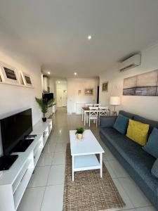 a living room with a couch and a table at COSTA AZUL APARTMENTS - 2B in Puerto de Mogán