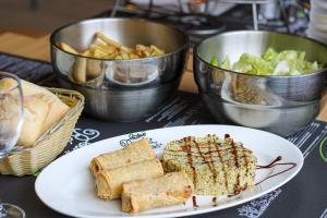 a plate of food on a table with food at ibis Saint Gratien - Enghien-Les-Bains in Saint-Gratien
