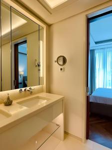 a bathroom with a sink and a mirror at MBroker - Porto Montenegro Elena residence apartments in Tivat