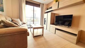 TV a/nebo společenská místnost v ubytování Apartamentos Vacacionales Joctis, 1º A