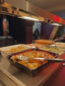 a pan of food on a counter in a restaurant at The Western in St Ives
