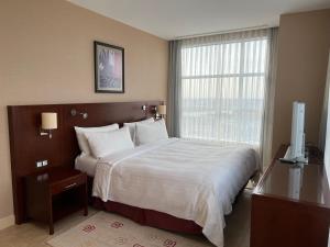 Кровать или кровати в номере Atyrau Executive Apartments