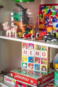 a shelf with toys and a meo box on it at Light modern Pallo apartment by the lake Saimaa in Lappeenranta
