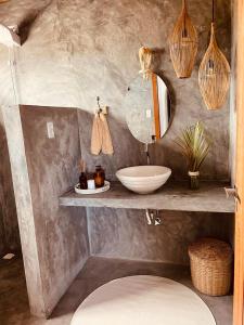 a bathroom with a sink and a mirror at Casa.mar Casa Hotel in Barra Grande +46 photos