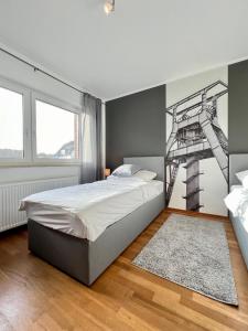 a bedroom with a bed and a ladder on the wall at pottapartments - balkon - küche - wifi - nespresso in Herne