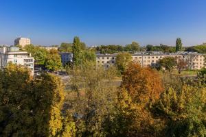 an aerial view of a city with trees and buildings at Bright & Cozy Studio near Metro Marymont by Renters in Warsaw