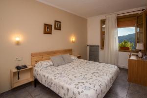 Posteľ alebo postele v izbe v ubytovaní Hostal Montserrat