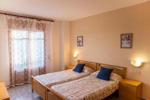 Posteľ alebo postele v izbe v ubytovaní Hostal Montserrat