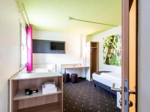 Postel nebo postele na pokoji v ubytování B&B Hotel Ingolstadt-Ost