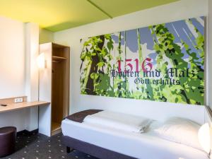 Postel nebo postele na pokoji v ubytování B&B Hotel Ingolstadt-Ost