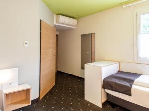 Postel nebo postele na pokoji v ubytování B&B Hotel Ingolstadt-Ost