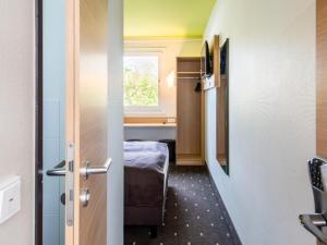 Postel nebo postele na pokoji v ubytování B&B Hotel Ingolstadt-Ost