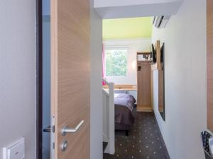 Postel nebo postele na pokoji v ubytování B&B Hotel Ingolstadt-Ost