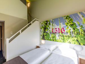 Postel nebo postele na pokoji v ubytování B&B Hotel Ingolstadt-Ost