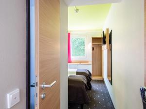 Postel nebo postele na pokoji v ubytování B&B Hotel Ingolstadt-Ost